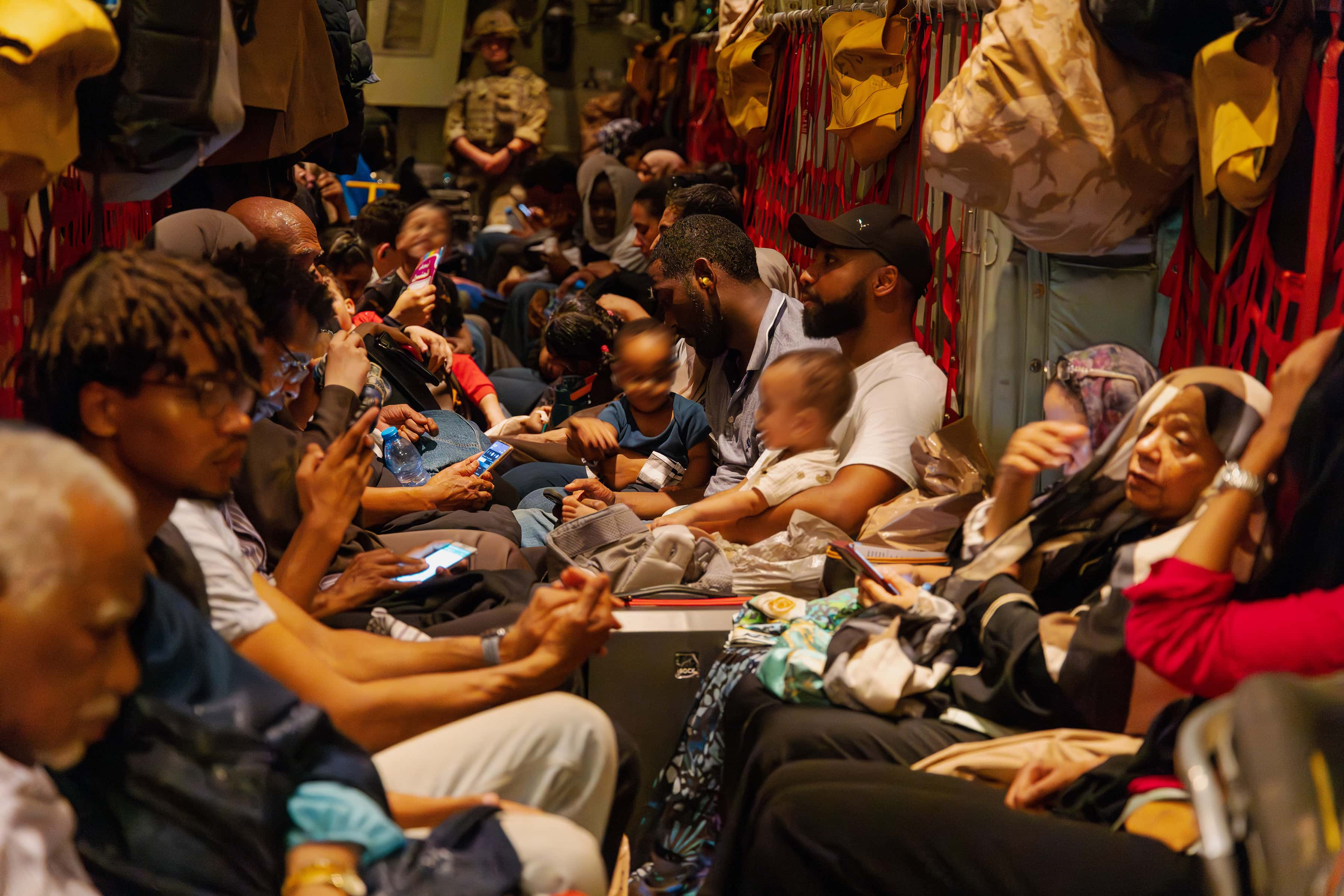 IN AIR - APRIL 25: In this handout image provided by the Ministry of Defence, Image of British Nationals safely onboard an RAF aircraft, after being evacuated from Sudan, on April 25, 2023. The UK has undertaken a military operation to evacuate British nationals from Sudan, due to escalating violence. The armed forces conducted this complex operation under extremely challenging circumstances and their bravery and courage is commended. The operation involved more than 1,200 personnel from 16 Air Assault Brigade, the Royal Marines and the Royal Air Force. (Photo by MoD Crown Copyright via Getty Images)