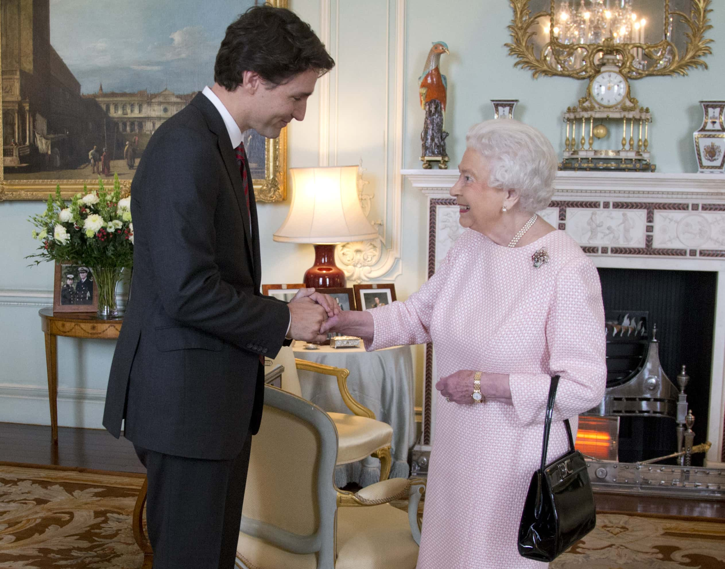 Image Source: Prime Minister of Canada Justin Trudeau shake hands with Queen Elizabeth II during a private audience at Buckingham Palace on November 25, 2015 in London, England. (Photo by Yui Mok - WPA Pool/Getty Images)