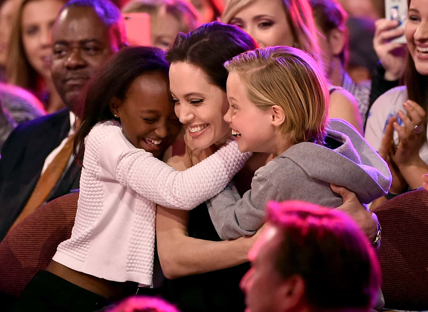 Actress Angelina Jolie hugs Zahara Marley Jolie-Pitt (L) and Shiloh Nouvel Jolie-Pitt (R) after winning award for Favorite Villain in 'Maleficent' during Nickelodeon's 28th Annual Kids' Choice Awards held at The Forum on March 28, 2015 in Inglewood, California. (Photo by Kevin Winter/Getty Images)