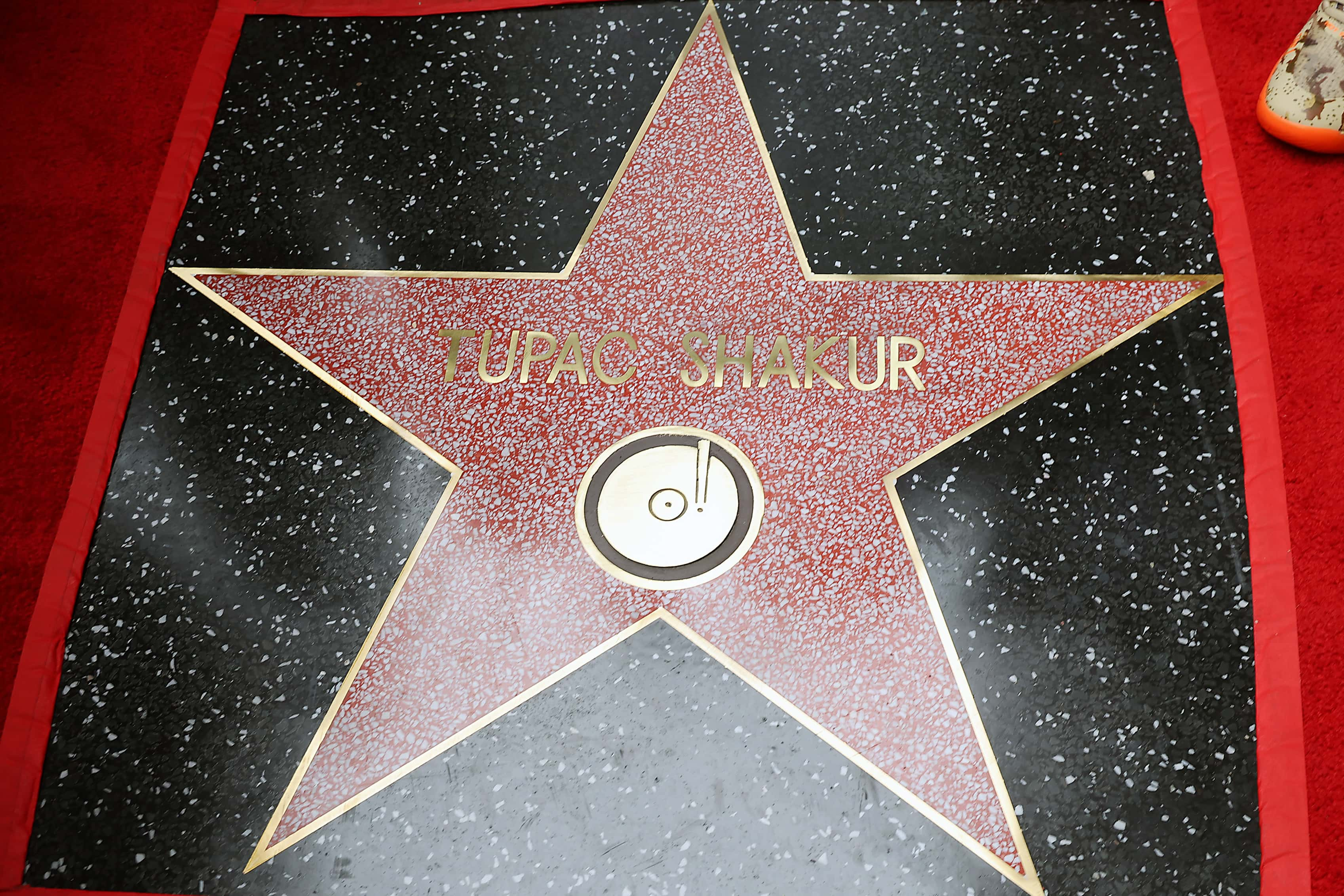 Image Source: Tupac Shakur is honored with a posthumous Star on The Hollywood Walk Of Fame on June 07, 2023, in Hollywood, California. (Photo by Leon Bennett/Getty Images)