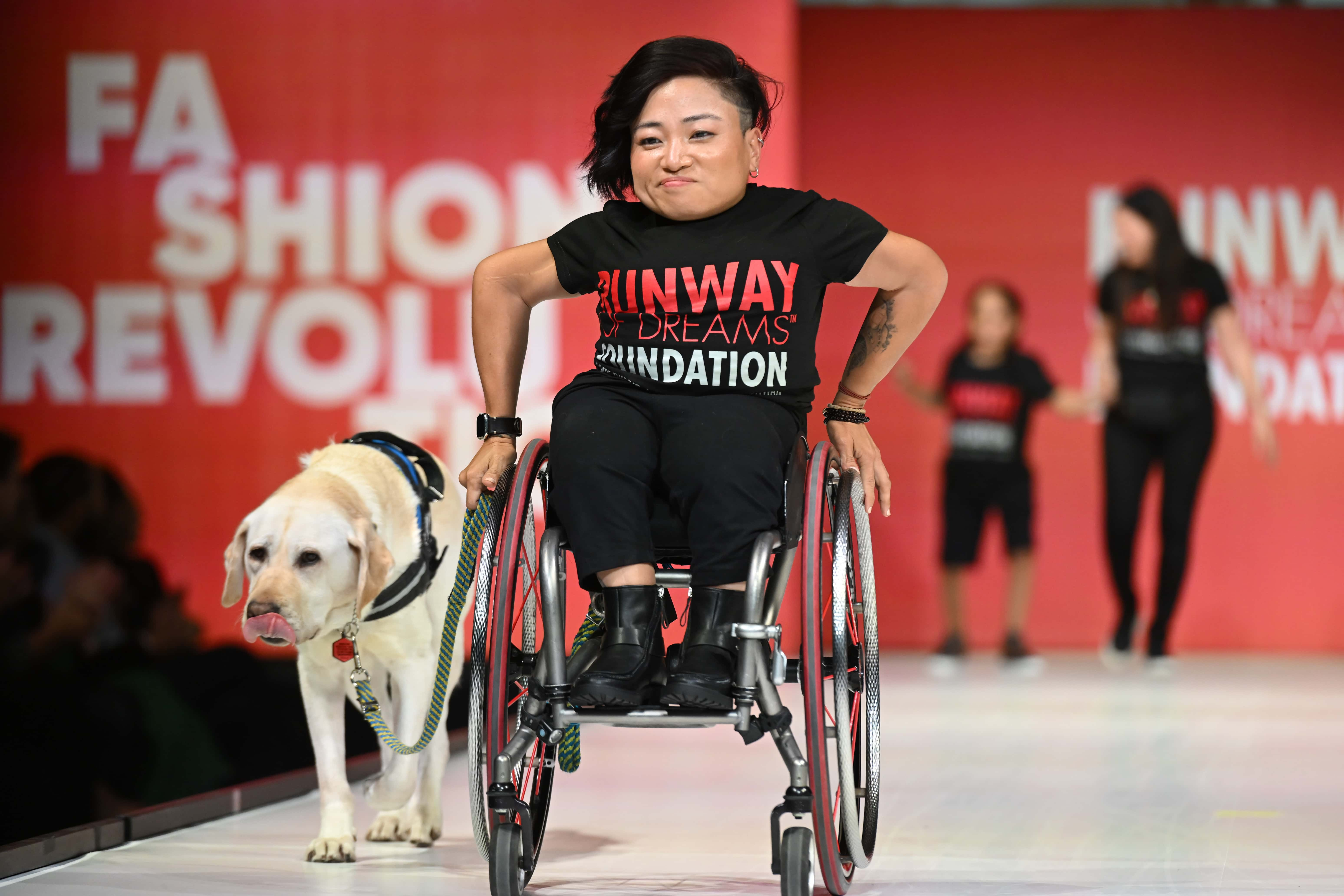 Zini and Mia Ives-Rublee model on the runway during Runway of Dreams: A Fashion Revolution at Powerhouse Arts on September 13, 2023 in Brooklyn, New York. (Photo by Noam Galai/Getty Images for Runway of Dreams )