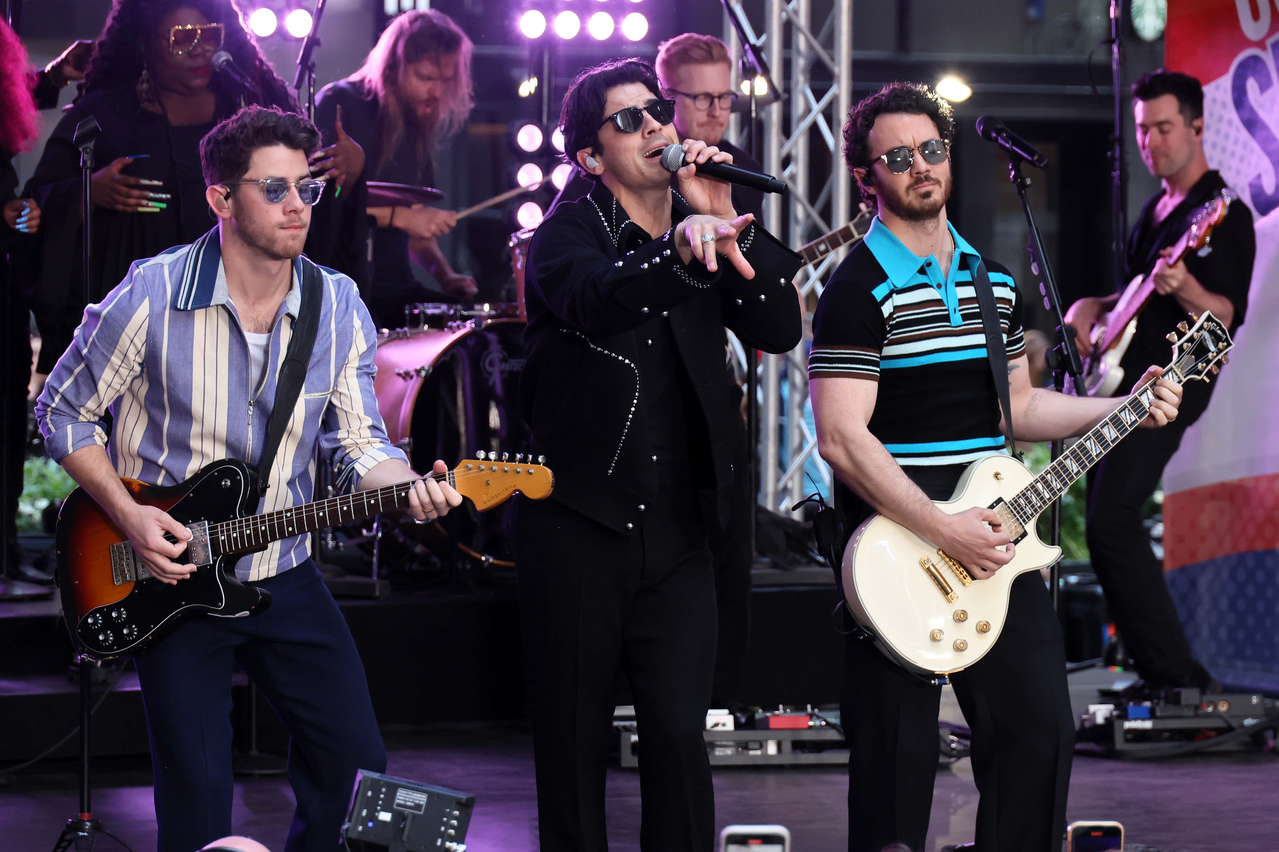 Image Source: Nick Jonas, Joe Jonas, and Kevin Jonas of the Jonas Brothers perform on NBC's 