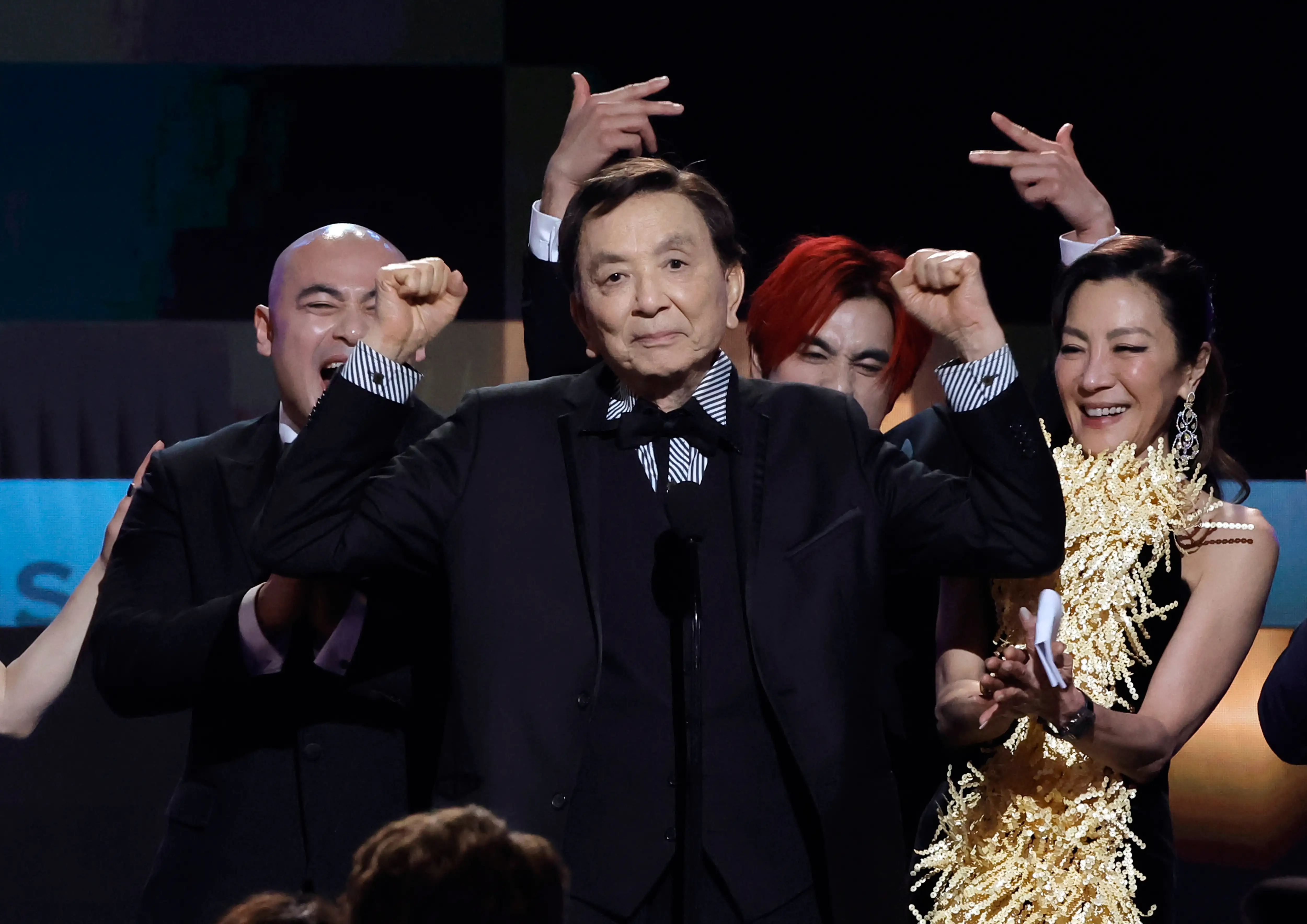 LOS ANGELES, CALIFORNIA - FEBRUARY 26: (L-R) Brian Le, James Hong, Andy Le, and Michelle Yeoh accept the Outstanding Performance by a Cast in a Motion Picture award for 