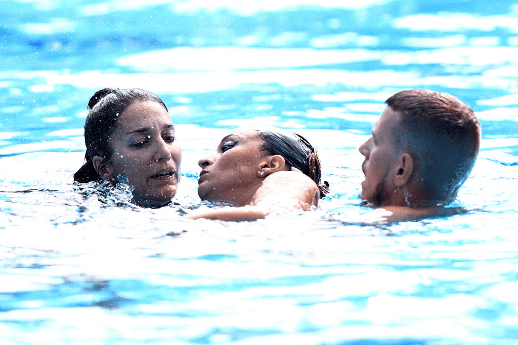 Team USA coach dives to save unconscious swimmer who sank to bottom of pool  during event