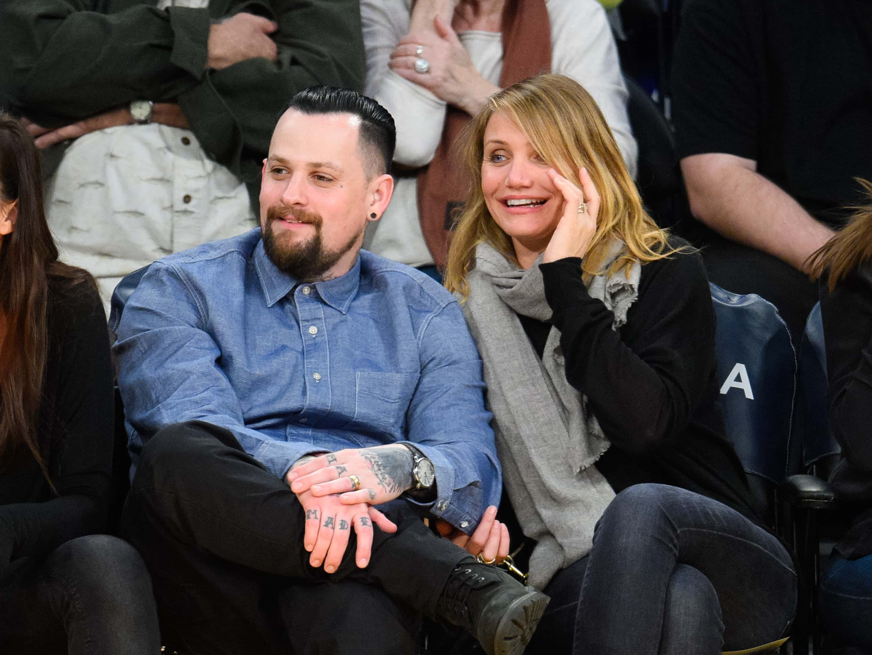 Image Source: Benji Madden (L) and Cameron Diaz attend a basketball game between the Washington Wizards and the Los Angeles Lakers at Staples Center on January 27, 2015 in Los Angeles, California. (Photo by Noel Vasquez/GC Images)