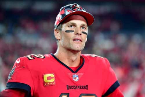 TAMPA, FLORIDA - DECEMBER 05: Tom Brady #12 of the Tampa Bay Buccaneers talks to the media after defeating the New Orleans Saints in the game at Raymond James Stadium on December 05, 2022 in Tampa, Florida. The Tampa Bay Buccaneers defeated the New Orleans Saints with a score of 17 to 16. (Photo by Julio Aguilar/Getty Images)