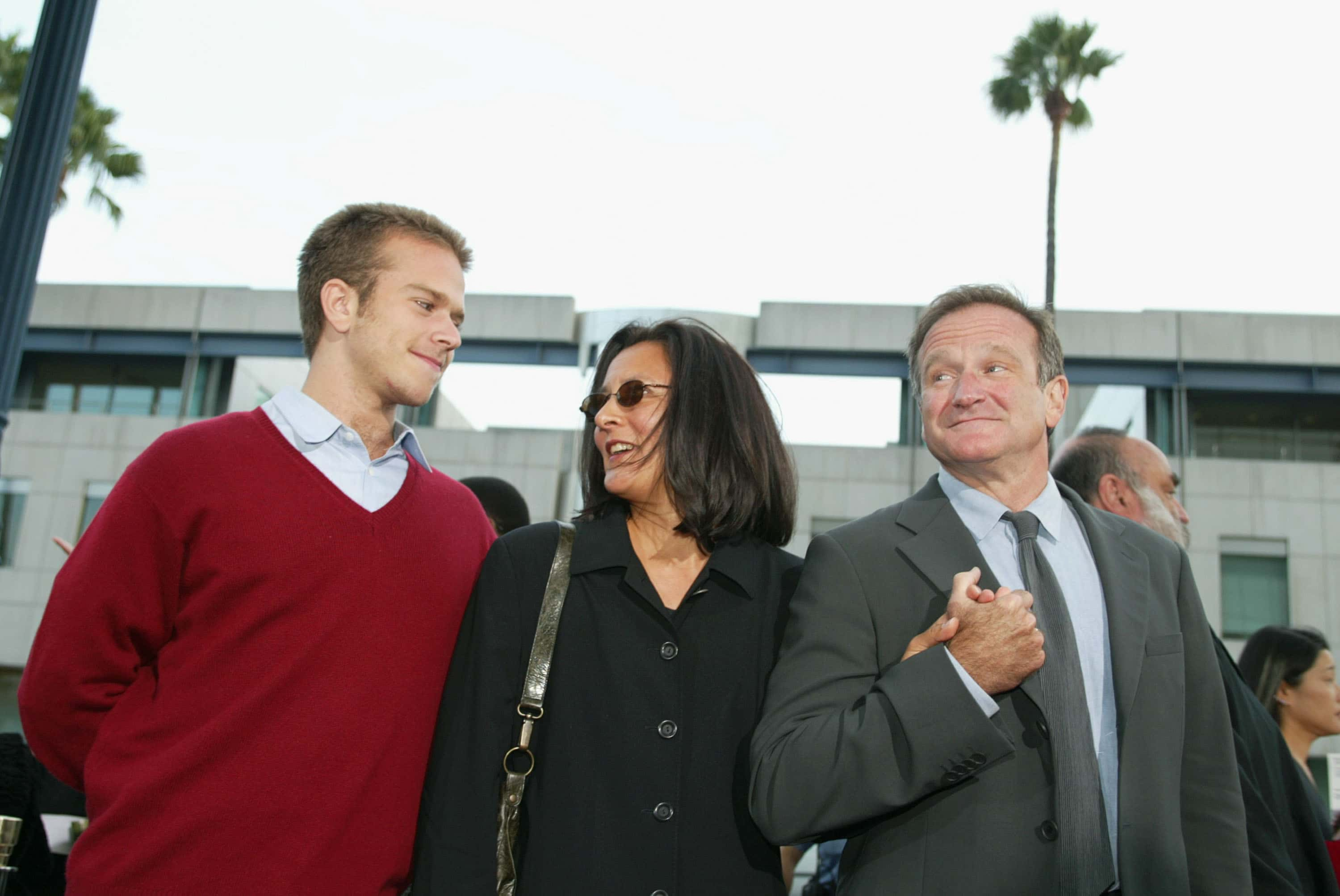 Image Source: Robin Williams with his wife Marsha and son Zachary at the premiere of 