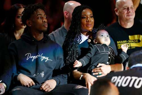 Zaire Wade, Gabrielle Union and Kaavia James Union Wade look on during the Dwyane Wade jersey retirement ceremony at American Airlines Arena - Getty Images | Michael Reeves