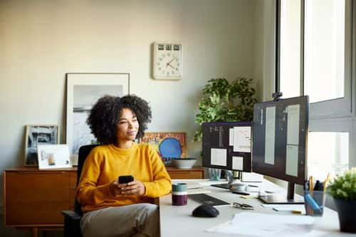 Young businesswoman working at home office - stock photo - Getty Images | Morsa Images
