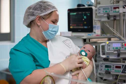 Nurse with a baby in intensive care. Newborn baby in the hospital. - stock photo
- Getty Images | Sviatlana Lazarenka