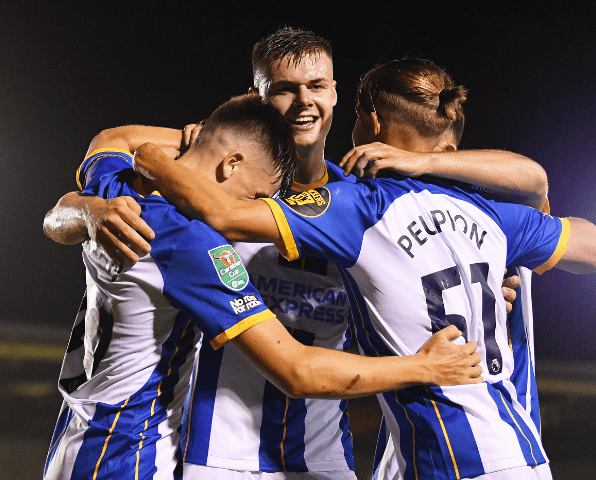 Evan Ferguson of Brighton & Hove Albion celebrates with team mates after scoring their team's third goal during the Carabao Cup. Image Source: Getty Images | Alex Burstow